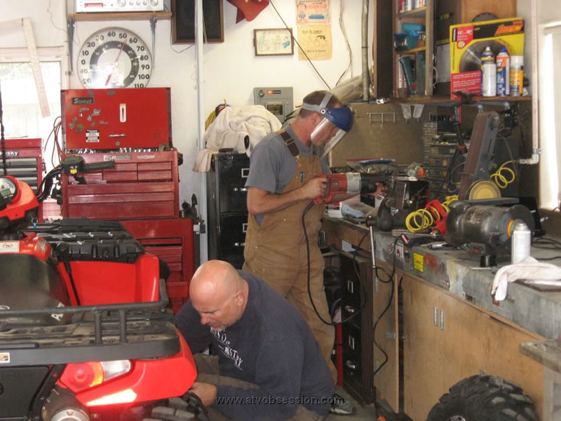 06. While Jack builds the bash plate, Ken begins installing the Footrest guards..jpg