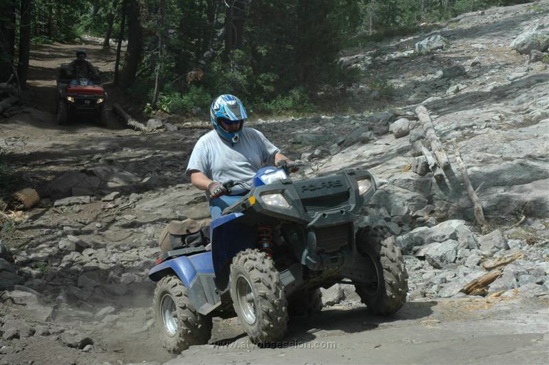 06. Chadd powers the customers quad up the first rock slab..jpg