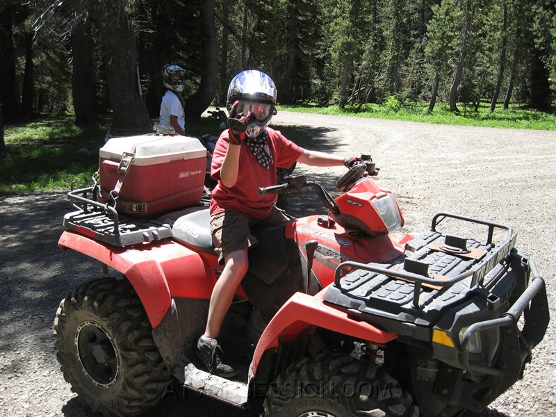 15. Kenan rides around a bit on Dad's 800..easy on the throttle boy..jpg