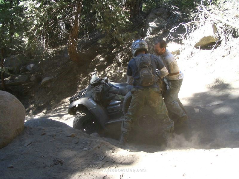009. Terry helps Dusty flip his ATV over...DOH!.jpg