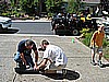 141. Terry and Dusty roll up my stuff for me...Mow my lawn next..jpg